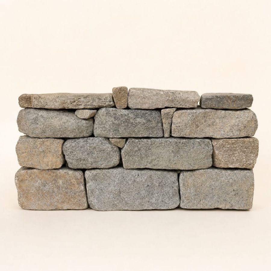 A single course of carefully stacked New England granite fieldstones